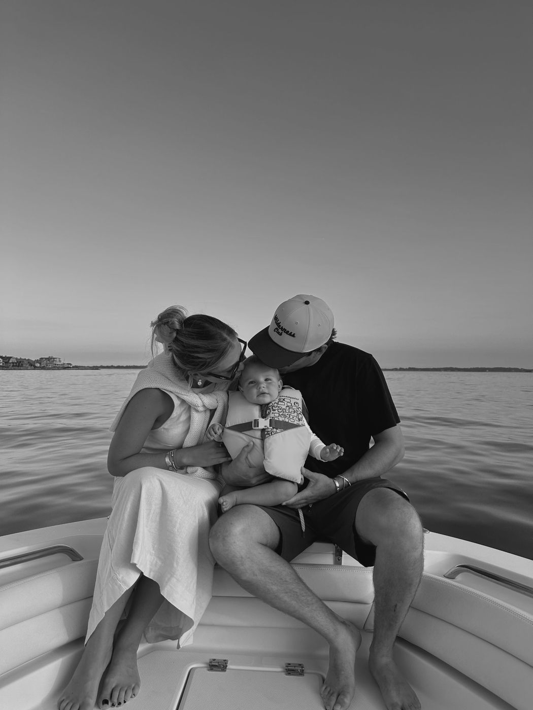 Alexa, her husband and their baby on a boat